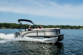 A Harris 210 Cruiser pontoon Boat with a happy Toronto couple enjoying a vacation on Gordon Bay water.