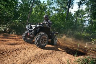 A man driving an ATV sold at Gordon Bay Marine