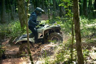 a man driving an ATV in Muskoka near Toronto Ontario