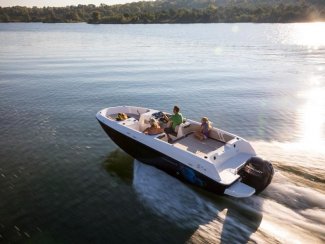 A boat cruising through the water in Muskoka near Toronto Ontario