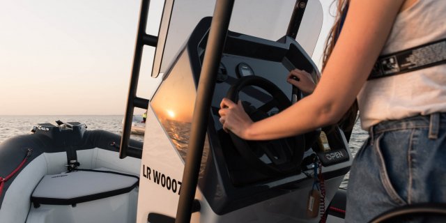 a woman steering her zodiac open 5.5 from gordon bay marine
